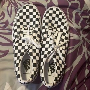 Checkered Black and White Vans.